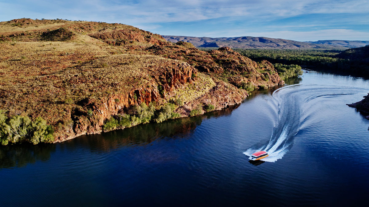 Seen from above, a cruise boat makes its way down Ord River, near Kununurra.